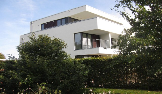Modern apartment with stunning views of the water and the Rügen Bridge in Altefähr