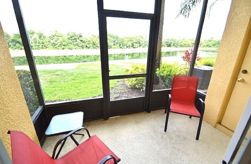 West Kissimmee Condo | Oakwater Resort, Two Miles to Disney, Lake View, Relax in our Hot Tub and Pool!